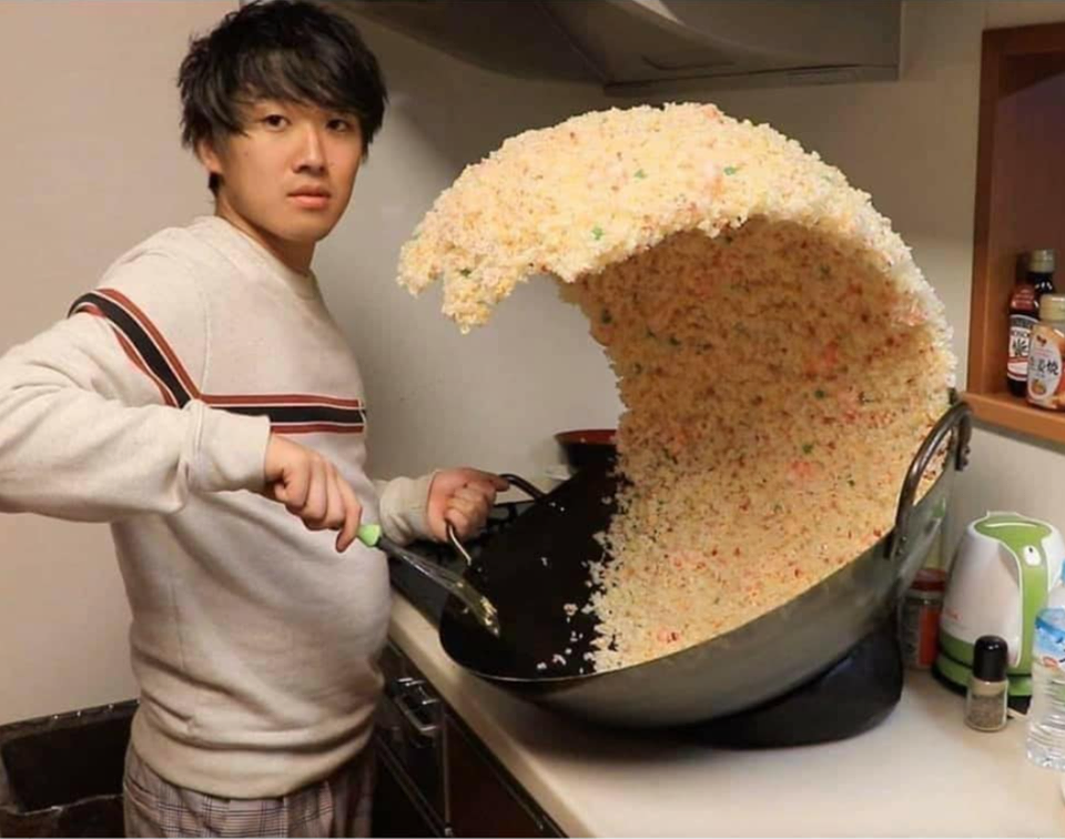 The meme is an image of a person who is clearly overwhelmed by a massive pile of rice. The text "I can smell the desperation" appears on the image, implying that the person is struggling to cope with the sheer amount of food in front of them. The image is humorous because it's an exaggerated and absurd situation, and the text adds to the comedic effect.